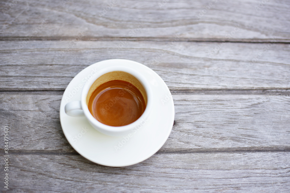 coffee in white coffee cup on wooden table coffee in white coffee cup on wooden table