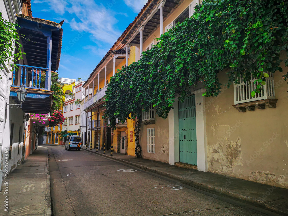 CARTAGENA, COLOMBIA - NOVEMBER 09, 2019: Colorful buildings in a street of the old city of Cartagena Cartagena de Indias in Colombia