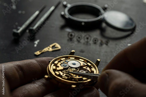 Mechanical watch repair. Watchmaker is repairing the mechanical watches