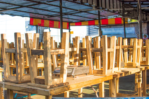 The grill restaurant is closed, with chairs on the table. The crisis of virus outbreak caused many shops to close. photo