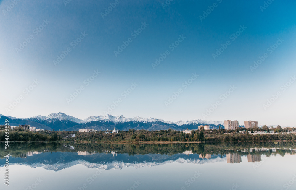 Kazakhstan nature lake reflection in water trees and mountains