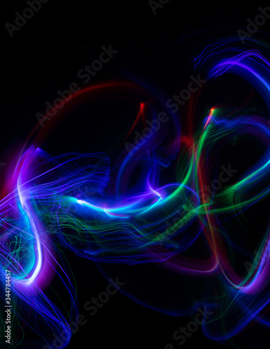 Abstract colored lights curves, frozen light, blue freeze light made with long exposure, black background