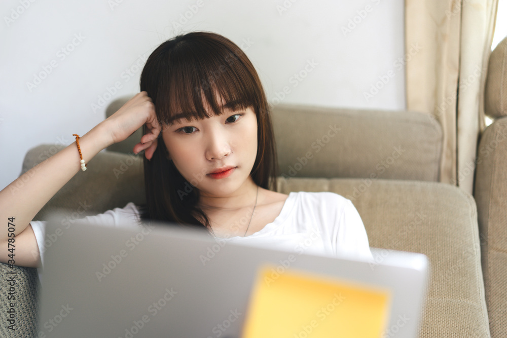 Asian teenager woman work and study online via internet at home. Asian teenager woman work and study online via internet at home.