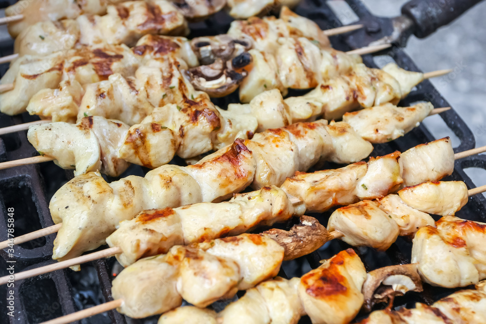 Chicken meat and champignon mushrooms skewers
