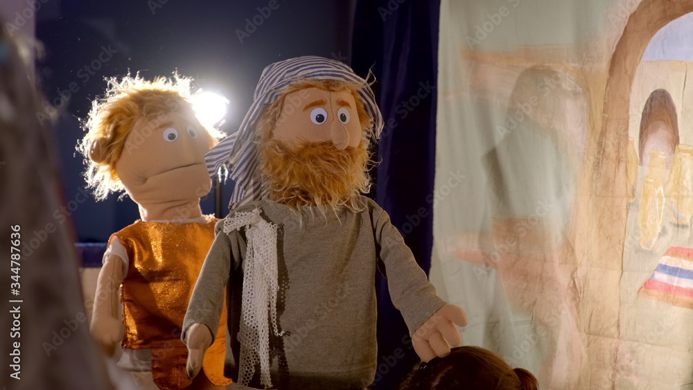 Puppet theater playing Bible story: puppet man with beard and in typical Asian clothing