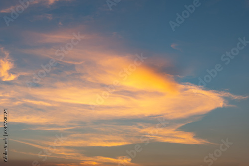 Dramatic cloudy sky during sunset  Texture of bright evening sky in twilight time background
