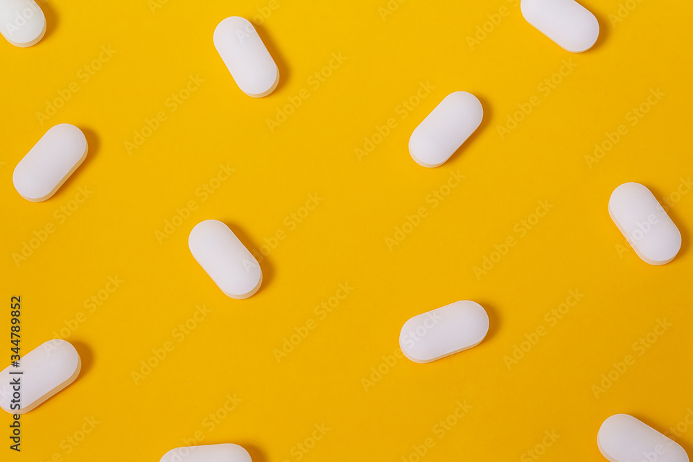 Vitamins for energy yellow background. Close up. Vitamins for energy yellow background. Close up.