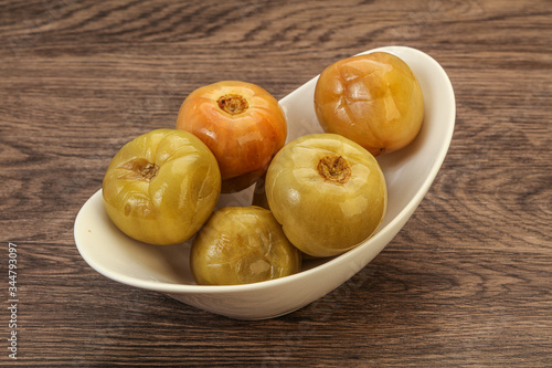 Pickled green tomato in the bowl