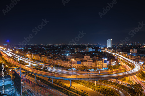 Aerial View Above of elevated road junction and traffic an important transport at night
