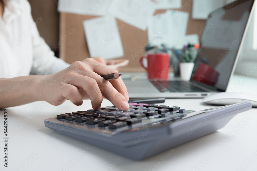 Bookkeeper or financial inspector hands making report, calculating. Home finances, investment, economy, saving money or insurance concept Bookkeeper or financial inspector hands making report, calculating. Home finances, investment, economy, saving money or insurance concept