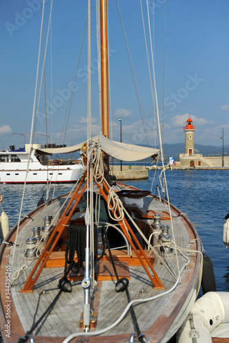 Lighthouse and old ships in the French marina