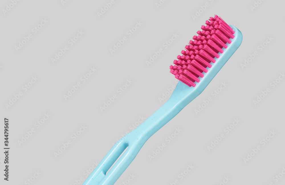 blue and pink plastic toothbrush sideways isolated blue and pink plastic toothbrush sideways isolated
