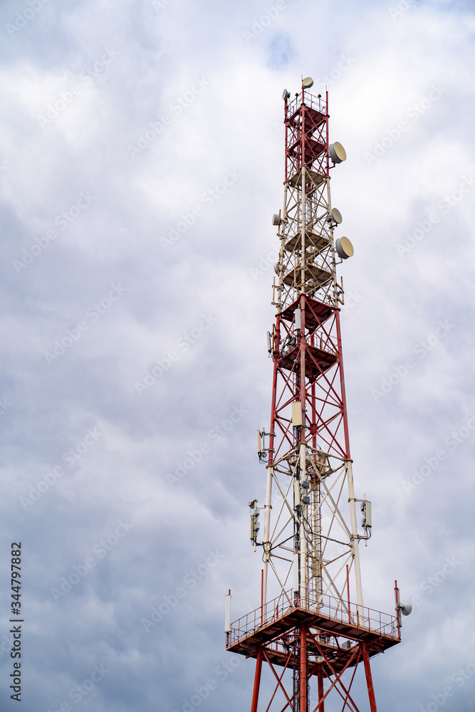 Telecommunication tower on cloud sky background Telecommunication tower on cloud sky background