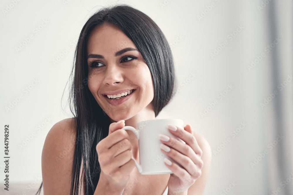 Portrait of cheerful girl that enjoying her tea Portrait of cheerful girl that enjoying her tea