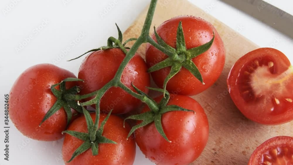 Healthy food ingredient - raw tomatoes on white background, vibrant colours, vitamin food Healthy food ingredient - raw tomatoes on white background, vibrant colours, vitamin food