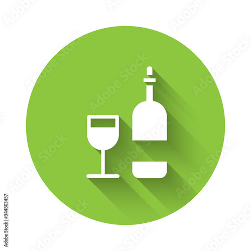 White Wine bottle with glass icon isolated with long shadow. Green circle button. Vector Illustration