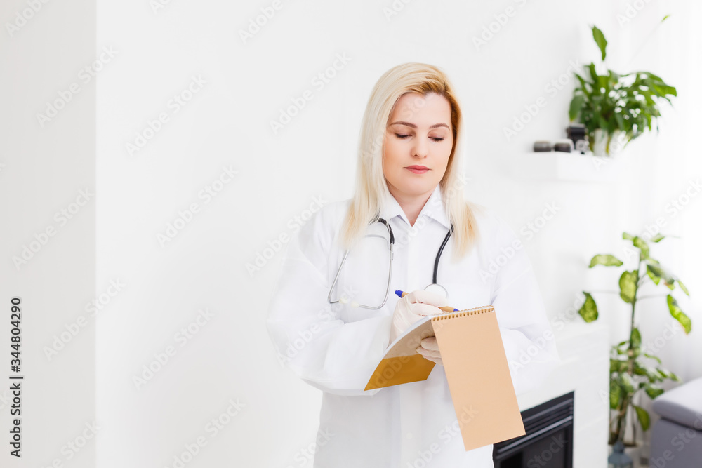 Smiling female doctor in white coat, on white Smiling female doctor in white coat, on white