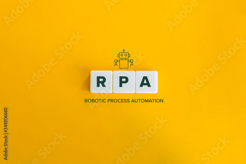 Robotic Process Automation (RPA) banner and data automation concept. Block letters and robot icon on bright orange background. Minimal aesthetics. photo