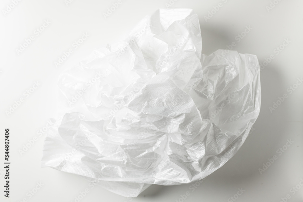 Squeeze a crumpled foam sheet isolated on white background with copy space. Squeeze a crumpled foam sheet isolated on white background with copy space.
