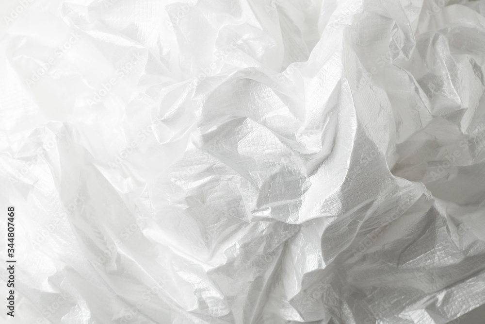 Squeeze a crumpled foam sheet isolated on white background with copy space. Squeeze a crumpled foam sheet isolated on white background with copy space.