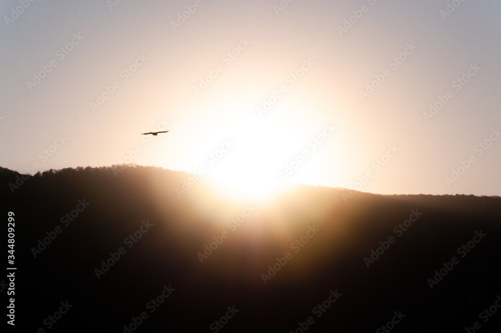 Sunrise behind a mountain top Sunrise behind a mountain top