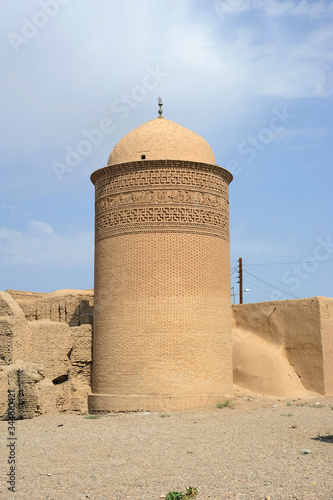 The Piri Alemdar Tomb is located in Damgan, Iran. The Piri Alemdar Tomb was built in the 11th century. The tomb is built of bricks. The motifs on the top are striking. photo