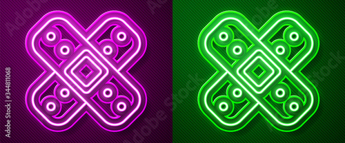 Glowing neon line Crossed bandage plaster icon isolated on purple and green background. Medical plaster, adhesive bandage, flexible fabric bandage. Vector Illustration