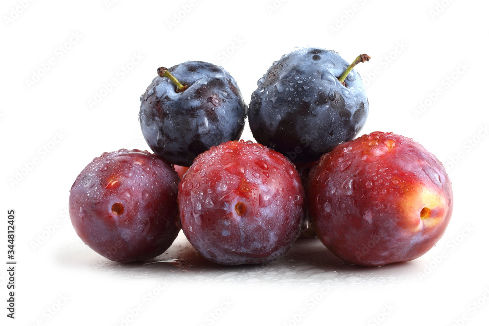 Fototapeta premium Red and black plums isolated on white