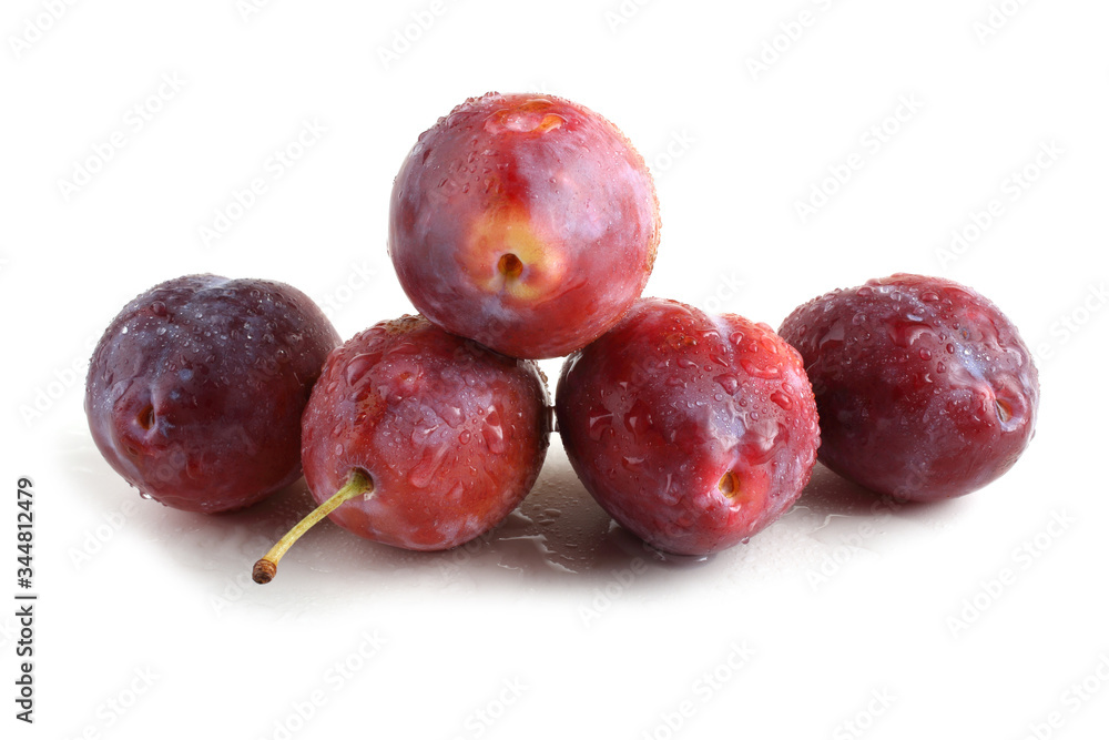 Red plums isolated on white