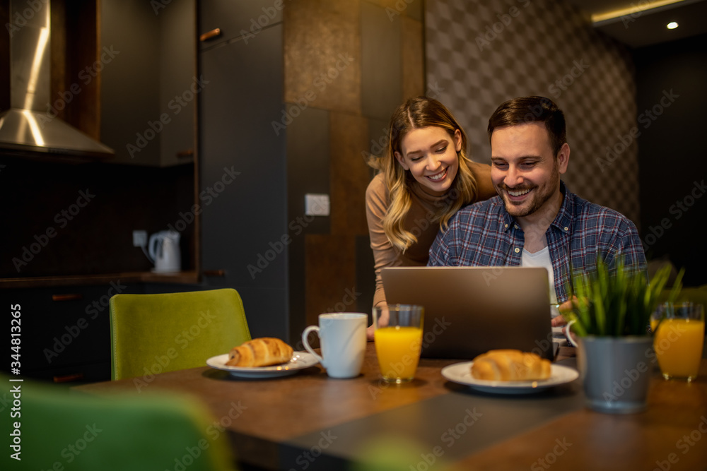 Couple shopping online at home Couple shopping online at home