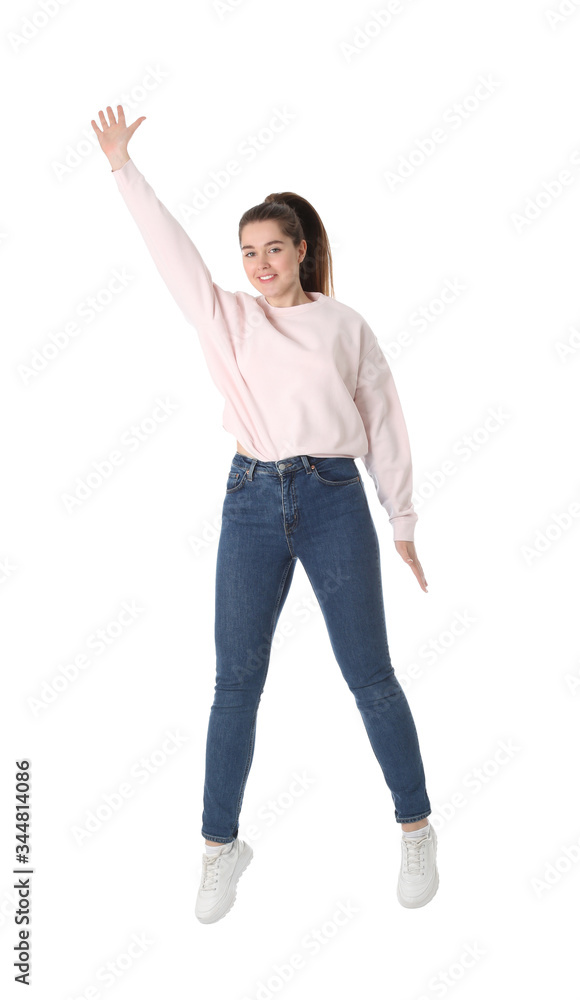 Happy young woman jumping on white background Happy young woman jumping on white background