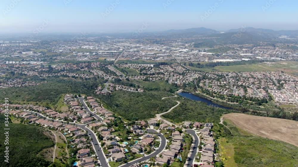 Aerial view of upper middle class neighborhood with big villas around Double Peak Park in San Marcos, California, USA. Aerial view of upper middle class neighborhood with big villas around Double Peak Park in San Marcos, California, USA.