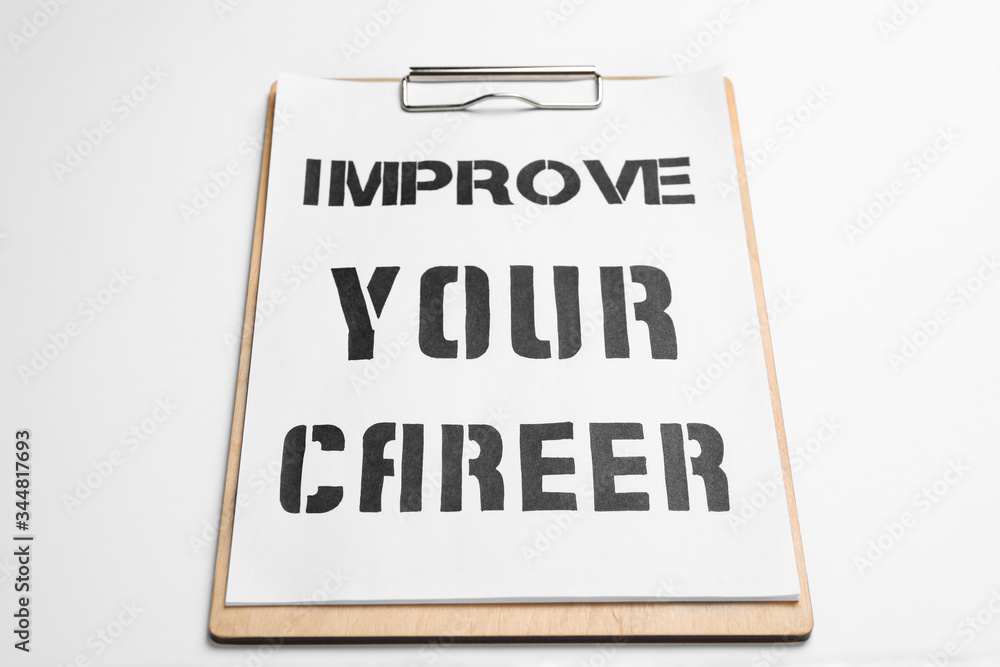 Clipboard with words IMPROVE YOUR CAREER on white background Clipboard with words IMPROVE YOUR CAREER on white background