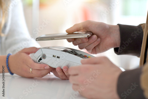 Closeup of payment with smartphone