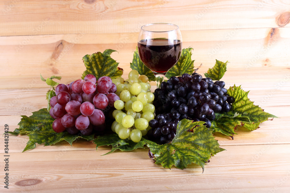 Grape and wine on table