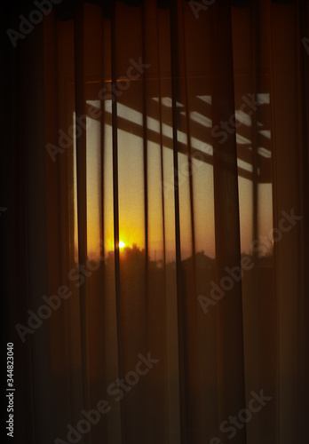 Sunset from window. Sunset in a peaceful village