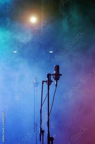 Microphones on stage at concert or music performance background