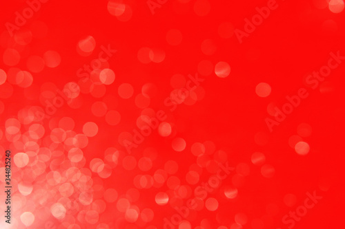 Red bright background with highlights, rays and bokeh