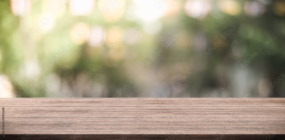 Empty wooden table top and green nature blur background for display product. Empty wooden table top and green nature blur background for display product.