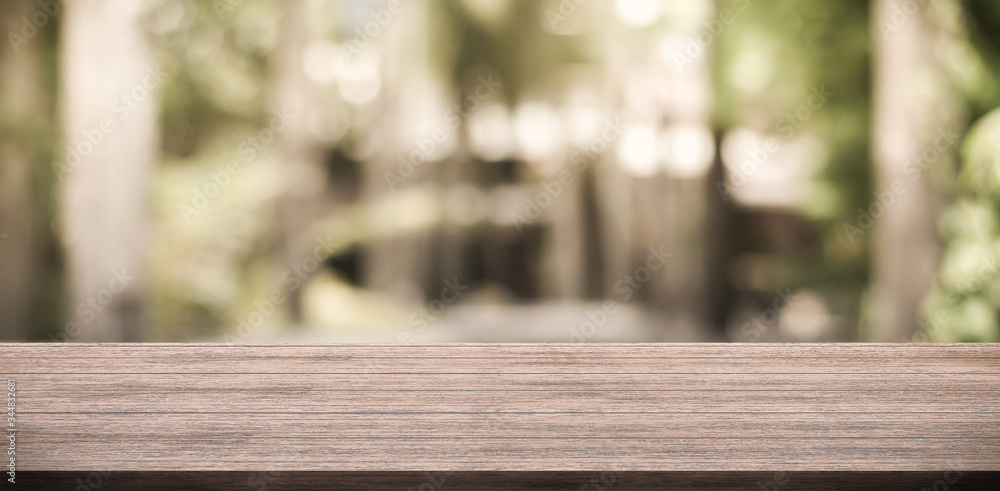 Empty wooden table top and green nature bokeh for display product Empty wooden table top and green nature bokeh for display product