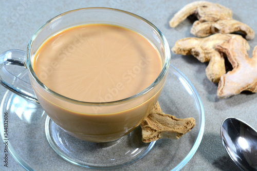 Indian dried ginger tea in a glass cup photo