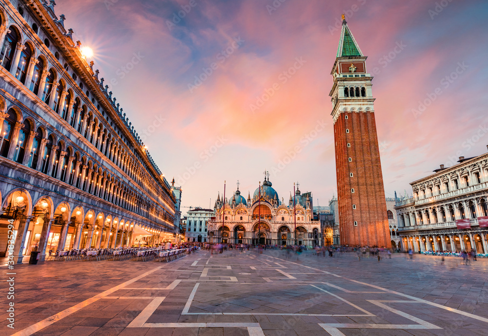Wonderful evening view of San Marco square with Campanile and Saint Mark's Basilica. Colorful cityscape of Venice, Italy, Europe. Traveling concept background.