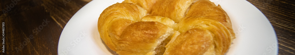 Croissant on dark background using as food bakery, shopping online delivery cover page concept. Croissant on dark background using as food bakery, shopping online delivery cover page concept.