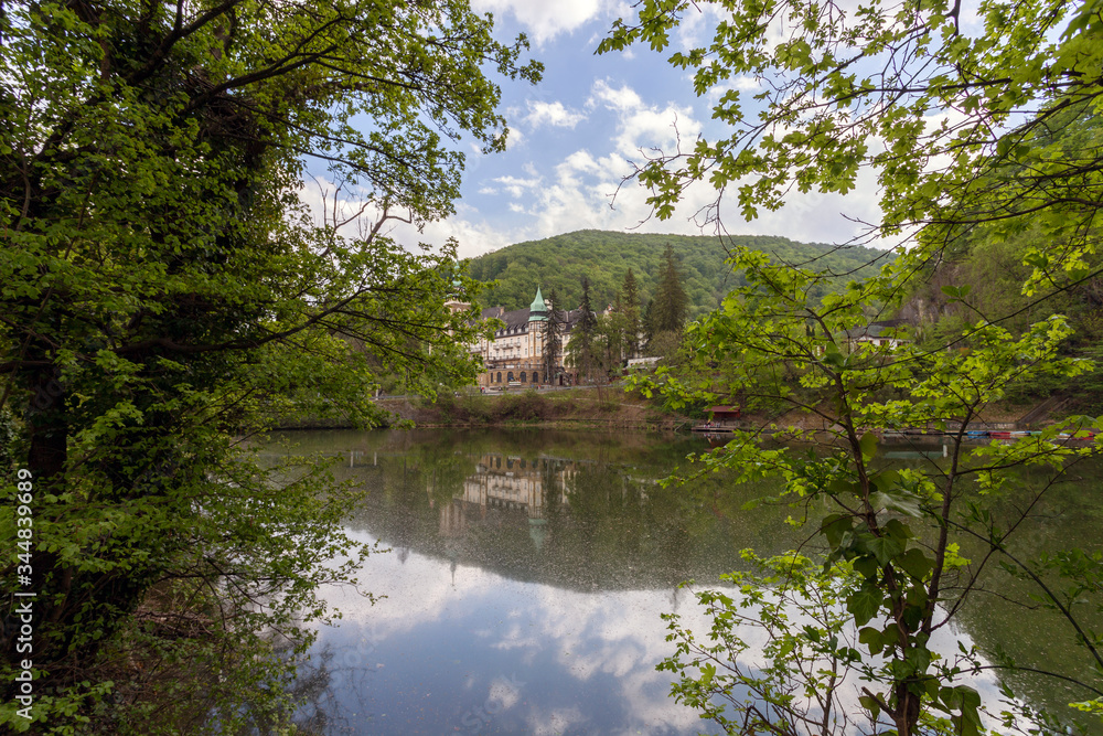 Lake Hamori with the Lilafured palace and Bukk mountains in the background