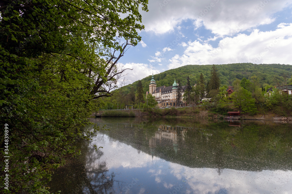 Fototapeta premium Lake Hamori with the Lilafured palace and Bukk mountains in the background