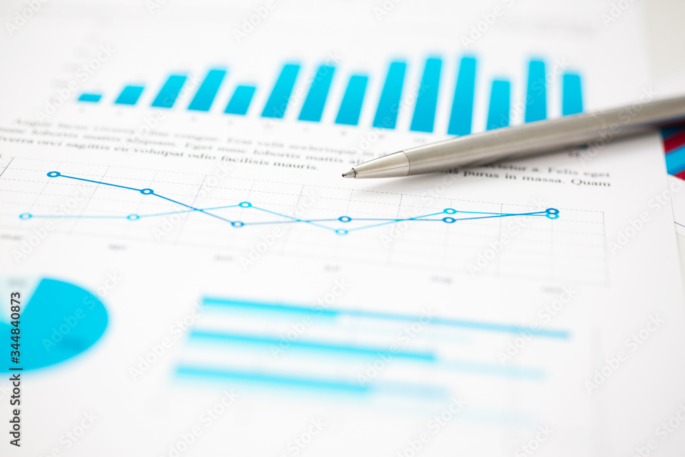 Financial statistics documents ball pen infographics at office table closeup. Internal Revenue Service inspector sum check, investigation, exchange market, earnings, savings, loan and credit concept Financial statistics documents ball pen infographics at office table closeup. Internal Revenue Service inspector sum check, investigation, exchange market, earnings, savings, loan and credit concept