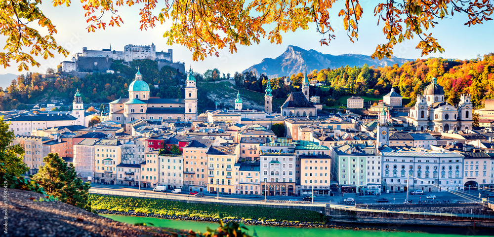 Panoramic cityscape of Salzburg, Old City, birthplace of famed composer Mozart. Colorful autumn scene of  Eastern Alps. Nice morning landscape with Salzach river. Traveling concept background.