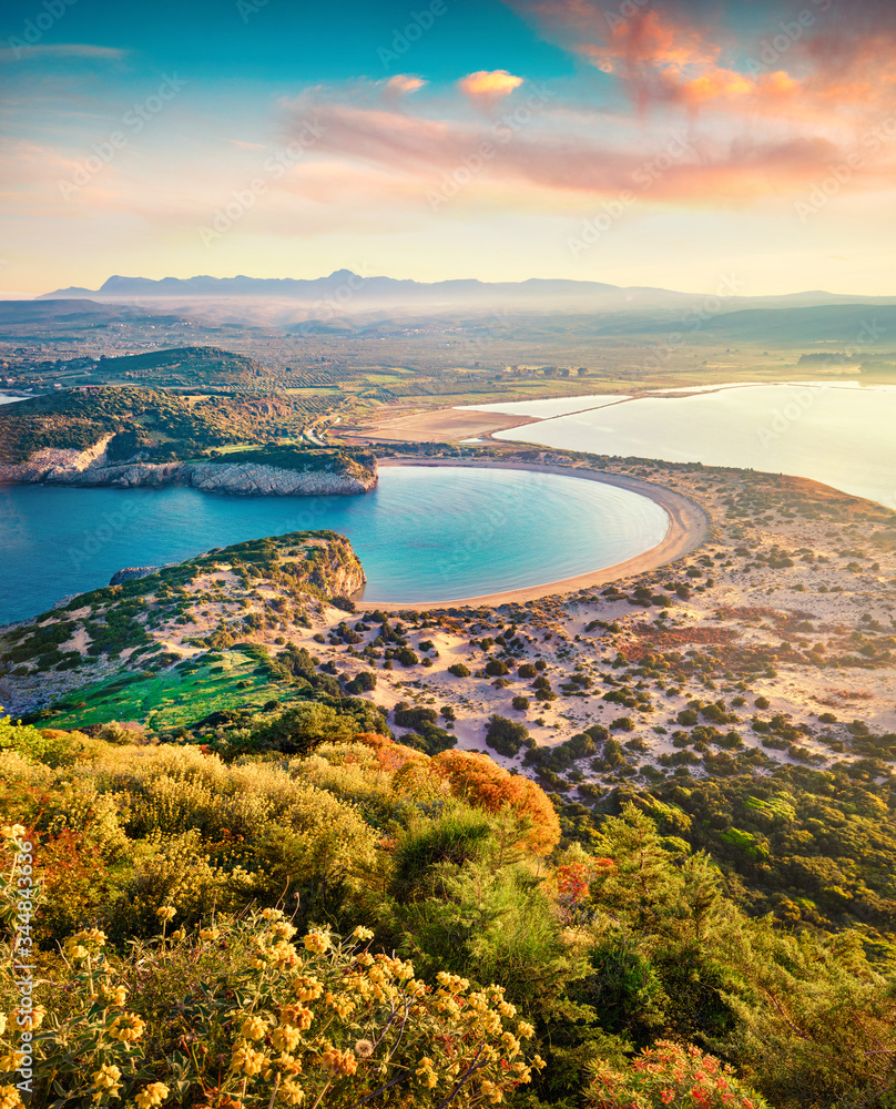 Aerial summer view of Voidokilia beach from Navarino Castle. Splendid sunrise on Ionian Sea, Pylos town location, Peloponnese, Greece, Europe. Beauty of nature concept background.