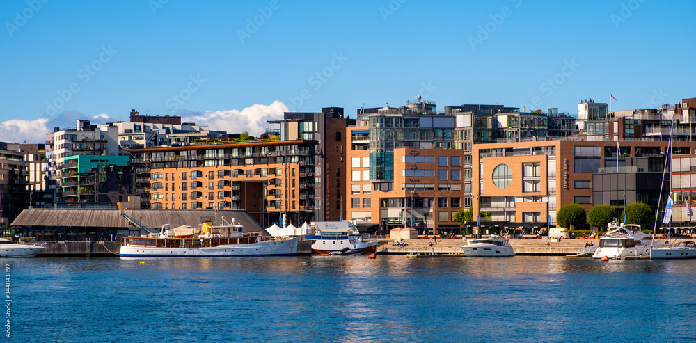 Oslo, Norway - Modern Aker Brygge borough of Oslo with yachts and piers at Oslofjord sea waterfront