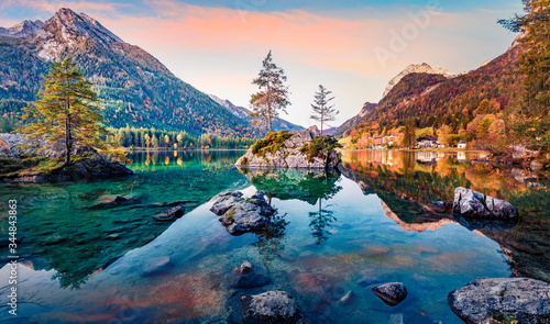 Calm morning scene of Hintersee lake with Hochkalter peak on background, Germany. Magnificent autumn view of Bavarian Alps. Beauty of nature concept background..